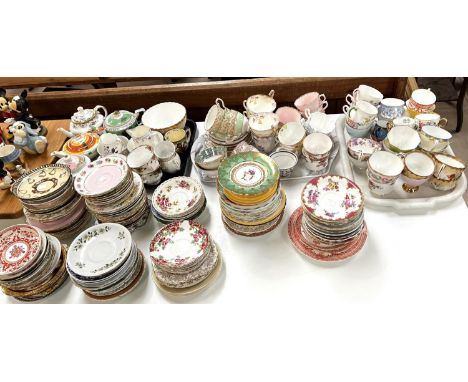 Four small ceramic teapots Noritake, Spode and a large collection of tea cups and saucers some matching and others 