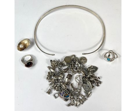 A silver charm bracelet with hallmarked silver heart-shaped lock, some charms silver, some not marked, gross weight 94gm; a M