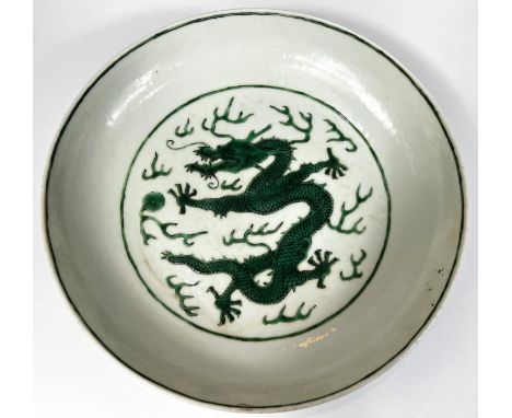 A chinese shallow dish decorated with enamel green dragon, with a pair of green dragons to exterior and orange dragon markto 