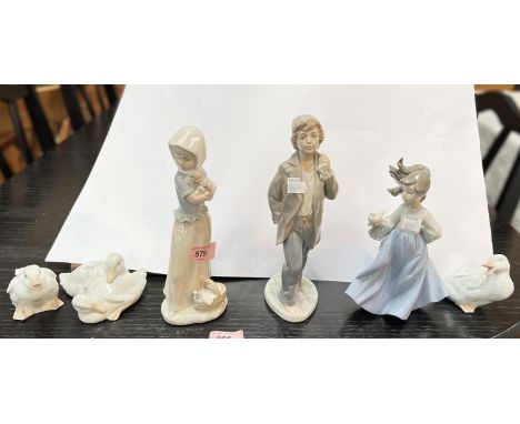 Three Nao figures of children and 3 Nao ducks. 