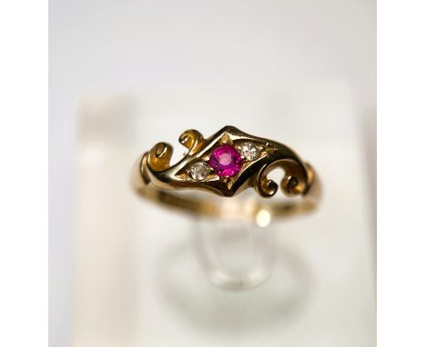 An 18 carat hallmarked gold ruby and diamond ring in ornate Victorian style crossover setting, 2.6gm, size 'R/S' 