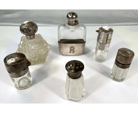 A glass hip flask with silver plated top and cup; a silver top scent spray by Mappin &amp; Webb; 5 various scent/toilet water