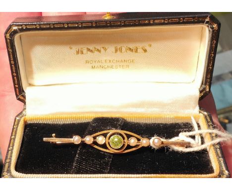 Peridot pearl bar brooch stamped 15, 2.6gm; pair of matching earrings (unmarked) 