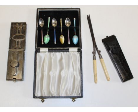 A pair of Edwardian bone handled curling tongs and warmer, each in crocodile hide case together with a cased set of six silve