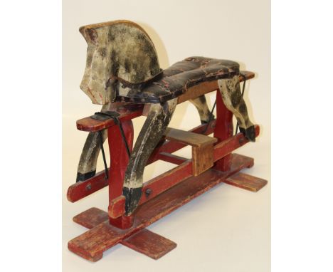 An early 20th century homemade rocking horse on cantilever stand. 90 x 63 x 32cm