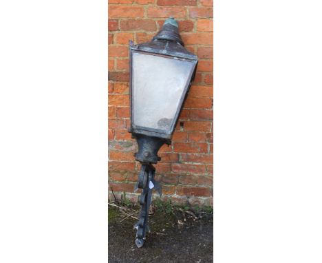A Victorian copper street lamp with a cast iron shoulder bracket. Total height 130cm