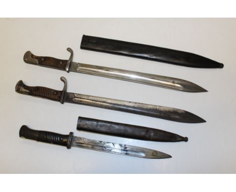 Two German 1898/05 Butcher bayonets ( one without scabbard and a WWII Mauser 98k bayonet by Weyersberg