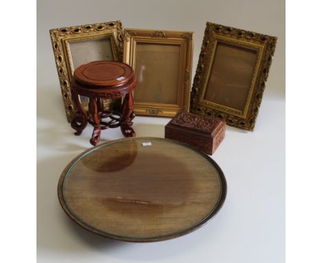 An Edwardian mahogany lazy Susan, 47cm diameter, a 20th century Chinese hardwood stand, a carved Indian wood box and three gi
