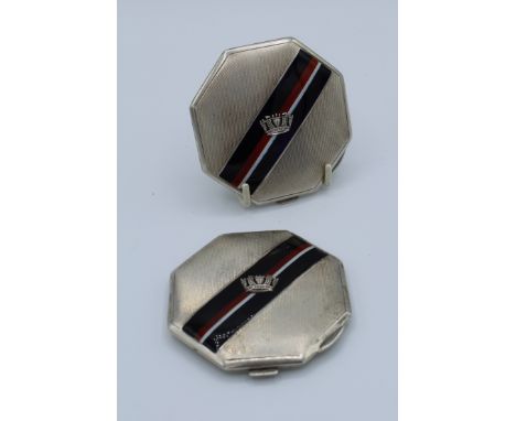 A pair of sterling silver and enamel compacts by Goldsmiths and Silversmiths Co Ltd. Dated 1938/1939 with military insignia. 