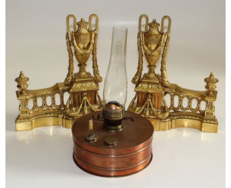 A pair of 20th century cast brass swag and urn andirons, 39 x 32cm, together with a Bryant paraffin lamp&nbsp;