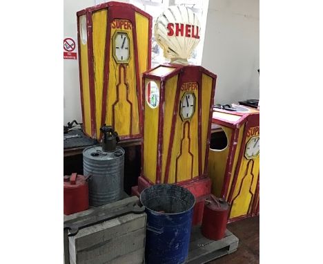 Garage scene comprising Petrol pumps, one with Shell Globe &nbsp;(plastic) oil drums, tools etc. Pumps approximately four fee