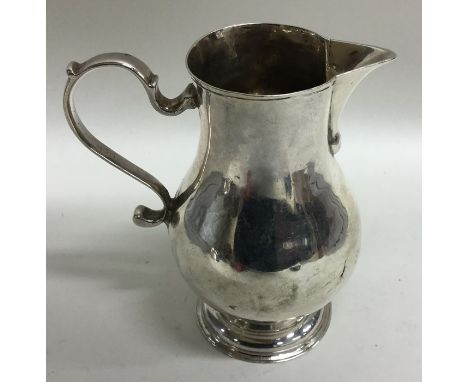 A rare Georgian pitcher cream jug on pedestal base. London 1735. By GI. Approx. 80 grams. Est. £300 - £400.