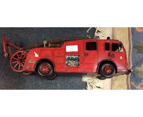 A tin plate model of a fire engine.