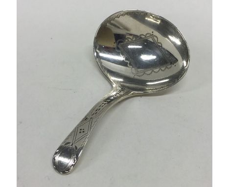 A good quality Georgian bright cut silver caddy spoon attractively decorated with wriggle work. London. By GB. Approx. 10 gra