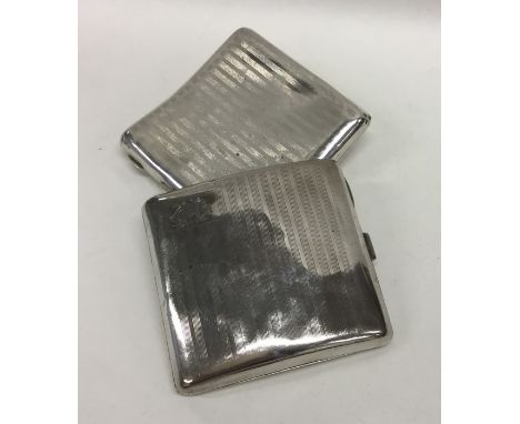 Two heavy silver engine turned cigarette boxes. Approx. 161 grams. Est. £20 - £30.