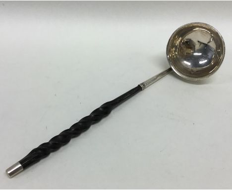 A small toddy ladle with whalebone handle. Approx. 15 grams. Est. £10 - £15.