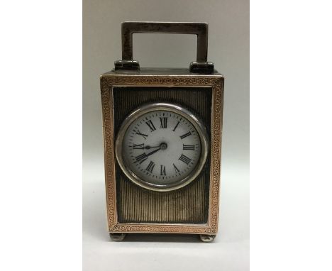 A good quality engine turned carriage clock with gold inlay. London. By PW. Approx. 263 grams. Est. £200 - £300. 