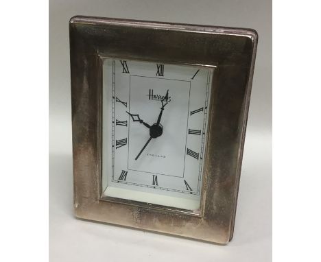 A modern silver mounted Harrods mantle clock. Est. £20 - £30.