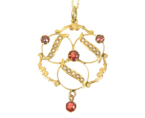 An early 20th Century red paste and split pearl pendantOf openwork design, the circular red paste and split pearl trefoil wit