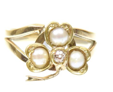 A diamond and split pearl ringDesigned as an old cut diamond and split pearl shamrock, with tapered shoulders, ring size J, w