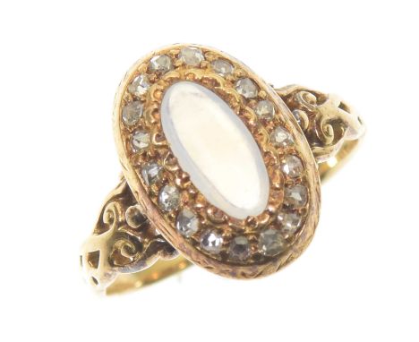 A moonstone and diamond cluster ringThe oval moonstone cabochon within a rose cut diamond setting, stamped 18ct, ring size K,