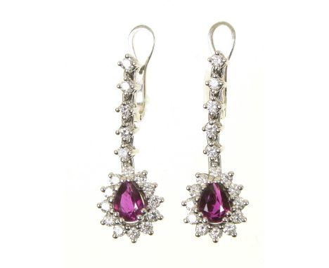 A pair of ruby and diamond earringsEach designed as a pear shaped ruby and brilliant cut diamond cluster, suspended from a si