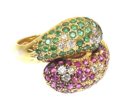 A vari gem snake ringThe circular shaped emerald and ruby crossover snakes, with brilliant cut diamond trefoil accents, stamp