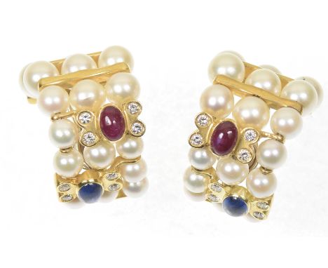 A pair of sapphire ruby and cultured pearl earringsEach designed as a grid of graduated cultured pearls, with oval sapphire a