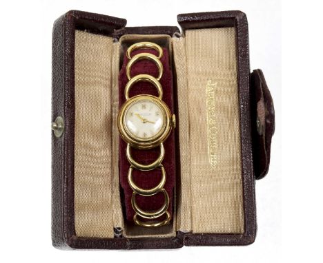 A 1950s 9ct gold Jaeger Le Coultre ladies wristwatchThe circular cream dial with Arabic and baton hour markers, movement sign