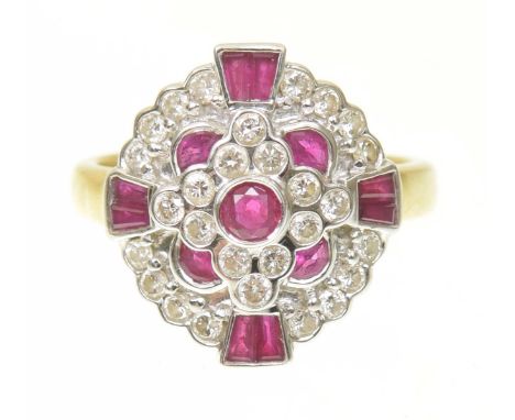 A ruby and diamond cluster ringThe circular ruby collet within a brilliant cut diamond and vari shaped ruby tiered surround, 