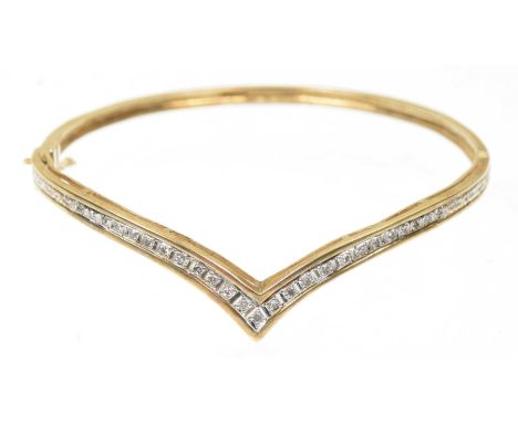 A 9ct gold diamond hinged bangleThe single cut diamond chevron line with a plain hinged reverse, hallmarks for Birmingham, 19