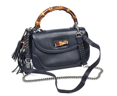 A Gucci Bamboo tassel top handbagThe navy leather exterior with piping detail, single flap with twist bamboo clasp and bamboo