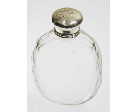 A Tiffany & Co. silver topped glass flaskThe faceted colourless glass flask with a silver monogrammed cap, signed and numbere