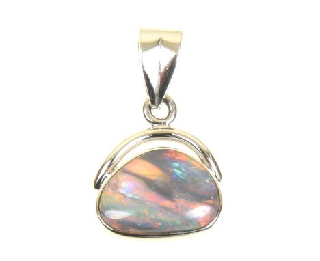 An opal pendantThe freeform opal panel within a collet setting and tapered surmount, stamped 750, length 1.7cm, weight approx