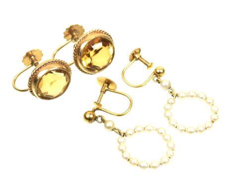 Two pairs of gem set earringsTo include a pair of 9ct gold citrine earrings, together with a pair of seed pearl hoop earrings