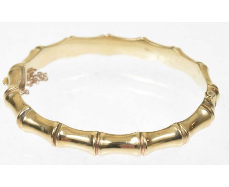 A 1960s 9ct gold hinged bamboo bangleWith partially concealed push-piece clasp, hallmarks for Birmingham, 1968, diameter 6cm,