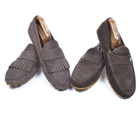 Two pairs of gents suede Gucci loafersEach a brown suede, one with silver tone monogram accent and the other with fringed dec