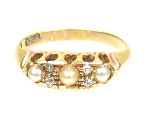 A diamond and cultured pearl dress ringThe cultured pearl line with vari cut diamond duo spacers, stamped 14k, ring size K, w