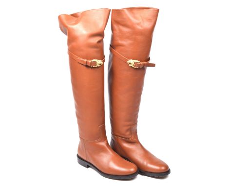 A pair of Valentino knee-high bootsThe tan leather over knee boots with lion buckle clasp detailing to front, labelled size 3