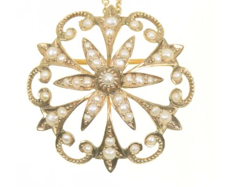 An early 20th Century split pearl pendantOf openwork design, the split pearl floral cluster within a split pearl scalloped su