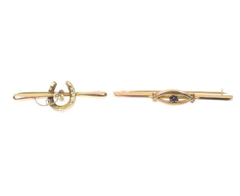 Two early 20th Century gem-set bar broochesTo include a split pearl horseshoe brooch, together with a purple paste bar brooch