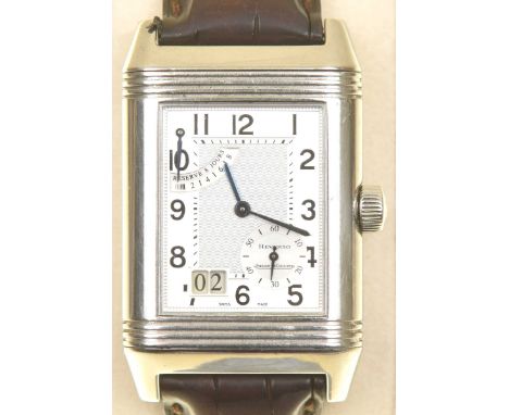 A gents stainless steel Jaeger Le Coultre 'Reverso Grande Date' wristwatchThe rectangular silvered dial with Arabic hour mark