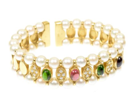 A tourmaline diamond and cultured pearl bangleOf sprung design, the series of pink and green oval tourmaline cabochons with p