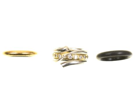 A Georg Jensen 'Magic' set of ringsThe principal ring in a coiled design with crossover shoulders, together with a diamond ba