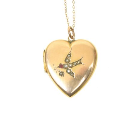 An Edwardian 9ct gold locketThe heart shaped hinged locket with split pearl and red gem dove motif to front, suspended from a