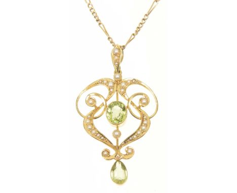 An early 20th Century peridot and split pearl pendantThe oval shaped peridot within a scrolling split pearl surround, with pe