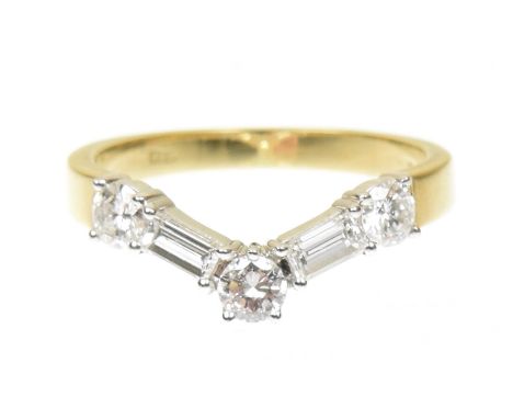 An 18ct gold Boodles & Dunthorne diamond band ringDesigned as a brilliant cut and rectangular shaped diamond curved line, est