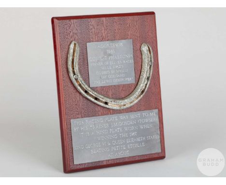 Shoe worn by the racehorse Aggressor when winning the 1960 King George VI and Queen Elizabeth Stakes at Ascot,mounted on a wo