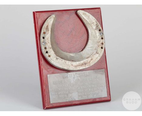 Special farrier-made shoe worn by the racehorse Stilvi who suffrered from the foot condition laminitis,mounted on a wooden pl