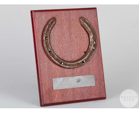 Show worn by the racehorse Doyoun,mounted on a wooden plaque with easel support and set with an engraved metal plaque, 20 by 